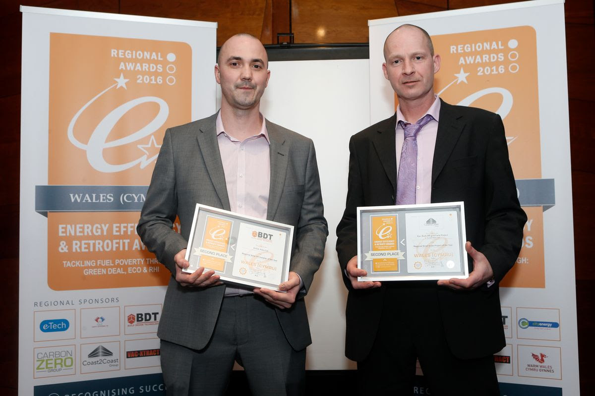Ian Hewson receiving a Welsh energy efficiency award for the Parc Bach Farm off-grid project